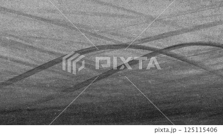 Car tire mark on race track, Abstract black car tire mark on race track, Abstract texture background car tire mark skid mark on asphalt circuit, Tire track on road race speed track circuit. 125115406