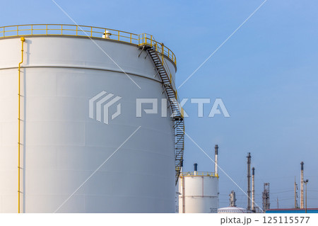 White oil storage tank with blue sky background at oil and gas refinery industrial zone, Business industrial factory oil and gas refinery, Crude oil and gas storage tank business logistic and 125115577