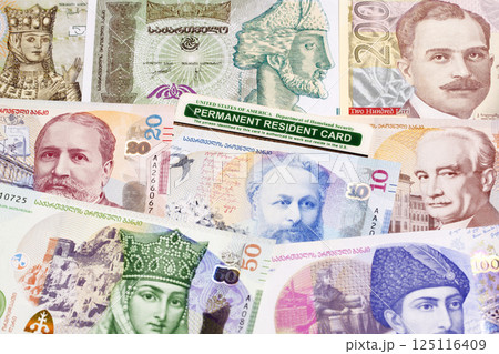 American permanent resident card on Georgian money American permanent resident card on Georgian money 125116409