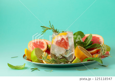 Refreshing summer drink with ice, citrus, rosemary and mint. 125118547