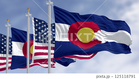 Colorado state and American flags waving in wind under blue sky. 3D render 125118791