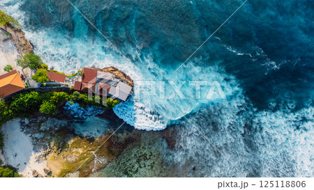 Tropical landscape with cape coastline and ocean with waves in Nusa Ceningan island, Bali. Aerial view 125118806