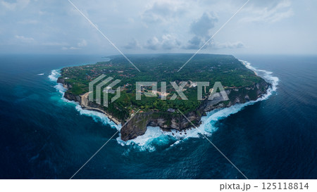 Panorama view of Uluwatu coastline with rocky cliffs, ocean with waves in Bali 125118814