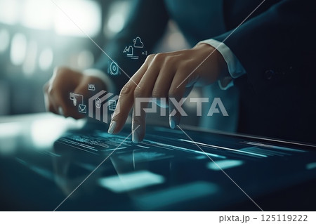 Professional Businessperson Accessing Cloud Technology on Interactive Digital Screen Professional Businessperson Accessing Cloud Technology on Interactive Digital Screen 125119222