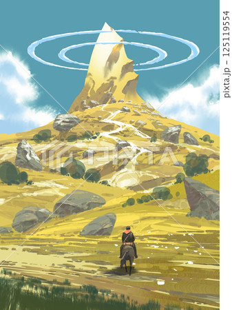 Lone Rider Approaches Isolated Mountain Peak 125119554