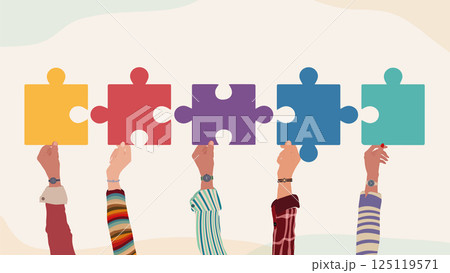 Different hands holding puzzle pieces as symbol of unity teamwork inclusion and collaboration Different hands holding puzzle pieces as symbol of unity teamwork inclusion and collaboration 125119571