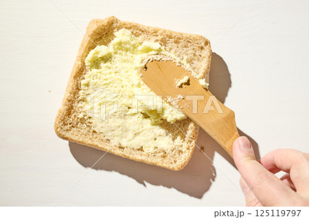 bread slice with whipped butter smear bread slice with whipped butter smear 125119797