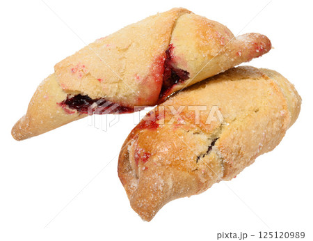 Two cookies filled with raspberry jam and sprinkled with sugar, isolated background. The pastry is golden brown Two cookies filled with raspberry jam and sprinkled with sugar, isolated background. The pastry is golden brown 125120989