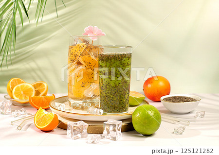 Detox diet and weight loss concept. Diet vegan cocktail with chia seeds, orange, lime, violet and ice. Summer party and healthy lifestyle advertisement. Summer banner and screen template. Detox diet and weight loss concept. Diet vegan cocktail with chia seeds, orange, lime, violet and ice. Summer party and healthy lifestyle advertisement. Summer banner and screen template. 125121282