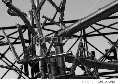Cast Iron Tubes Welded Under Different Angles In Disordered Pattern. Piping And Tubing Connection Concept Stock Photo Cast Iron Tubes Welded Under Different Angles In Disordered Pattern. Piping And Tubing Connection Concept Stock Photo 125121298