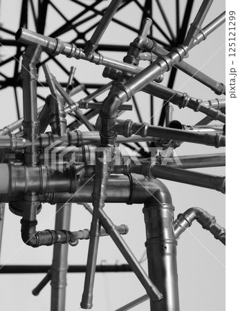Dark Iron Pipe Network Chaotic Structure. Stock Photo For Pipe Transport Illustration 125121299