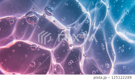 Aqua gel with pearlescent shimmer in soft blue and pink tones under reflective light 125122289