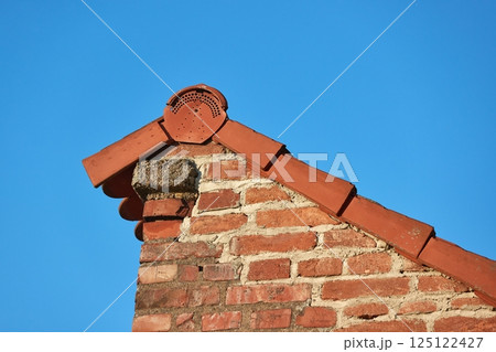 Roof and brick wall detail 125122427