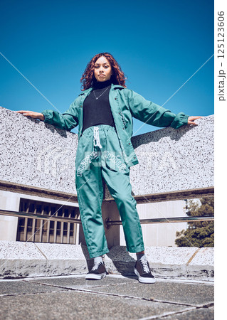 Green, designer and fashion black woman in urban city portrait pm blue sky mock up for marketing, advertising or youth promotion. Young gen z girl streetwear design clothes with mockup rooftop space Green, designer and fashion black woman in urban city portrait pm blue sky mock up for marketing, advertising or youth promotion. Young gen z girl streetwear design clothes with mockup rooftop space 125123606