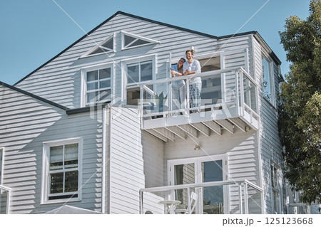 Love, couple and on balcony for vacation, holiday and in summer being happy for marriage, honeymoon and romantic. Romance, man and woman on weekend getaway, travel and bonding being loving and relax. 125123668