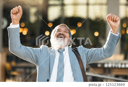 Senior businessman with success, winning and celebration for bonus, achievement and career goal. Elderly man entrepreneur, corporate worker or professional winner celebrate sale and profit outdoor 125123669