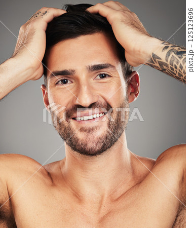 Skincare, happy and portrait of a man with a smile for wellness, beauty and dermatology against grey studio background. Cosmetic, healthy and face of a model with happiness for hygiene and freshness Skincare, happy and portrait of a man with a smile for wellness, beauty and dermatology against grey studio background. Cosmetic, healthy and face of a model with happiness for hygiene and freshness 125123696