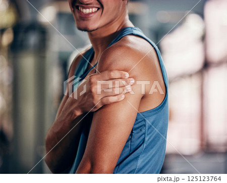 Sports injury, pain and arm massage at gym after accident during fitness training, exercise and workout with sore muscle or fibromyalgia. Man with orthopedic or arthritis problem at health club Sports injury, pain and arm massage at gym after accident during fitness training, exercise and workout with sore muscle or fibromyalgia. Man with orthopedic or arthritis problem at health club 125123764