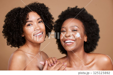 Skincare, portrait and women in studio for face, cream and product, beauty and wellness on brown background. Friends, black woman and facial, dermatology and luxury cosmetics, skin and hygiene mockup Skincare, portrait and women in studio for face, cream and product, beauty and wellness on brown background. Friends, black woman and facial, dermatology and luxury cosmetics, skin and hygiene mockup 125123892