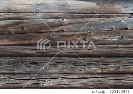 Old weathered log wall background 125123971