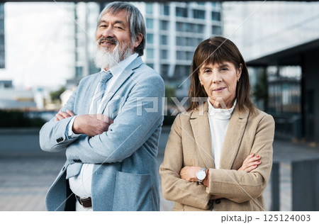 City portrait of diversity business team with crossed arms, confidence and pride in senior corporate job. Teamwork, collaboration and property developer partnership of realtor woman and Asian man City portrait of diversity business team with crossed arms, confidence and pride in senior corporate job. Teamwork, collaboration and property developer partnership of realtor woman and Asian man 125124003
