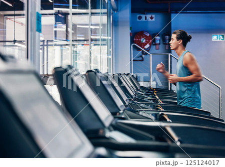 Running, fitness and man exercise on treadmill in gym workout, training or healthy cardio health, wellness and energy. Zoom, male and sports marathon athlete running in fitness practice for race 125124017