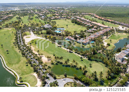 Aerial view on residence with houses and villas and golf fields 125125585