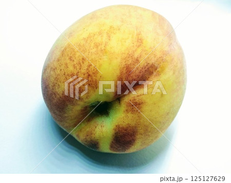 A picture of peach isolated on a white background 125127629