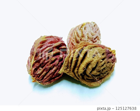 A picture of peach seeds isolated on a white background 125127638