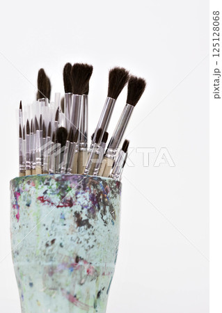 Brushes and spatulas on a white background. The tools of an artist or a sculptor for drawing. Creative professions, master classes. High quality photo Brushes and spatulas on a white background. The tools of an artist or a sculptor for drawing. Creative professions, master classes. High quality photo 125128068