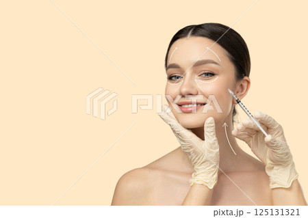 Botox. Skin Care. A girl gets a botox injection, on a light background. 125131321