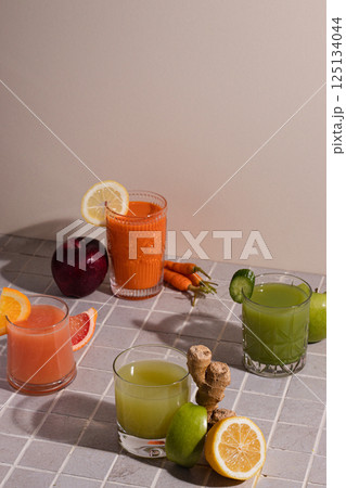 Assortment Fresh Organic Juices Smoothies Colored Different Glasses Red Yellow Orange Green Fruits Vitamins Health Concept light grey tile Background Toned, summer refreshments, ingredients Assortment Fresh Organic Juices Smoothies Colored Different Glasses Red Yellow Orange Green Fruits Vitamins Health Concept light grey tile Background Toned, summer refreshments, ingredients 125134044