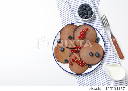 Chocolate pancakes, tasty breakfast, concept of delicious food, space for text 125135187