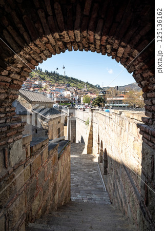 Metekhi church of the Nativity of the Mother of God on a cliff above Mtkvari river in Tbilisi, Georgia 125136162
