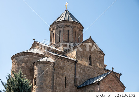 Metekhi church of the Nativity of the Mother of God on a cliff above Mtkvari river in Tbilisi, Georgia 125136172