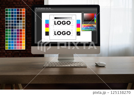 A creative woman sits at her desk using a tablet, drawing digital art for a web design agency with A creative woman sits at her desk using a tablet, drawing digital art for a web design agency with 125138270