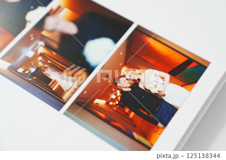 the pages of a photo book with wedding photos. the pages of a photo book with wedding photos. 125138344