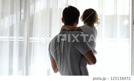Father and daughter sharing a tender moment at hotel window Father and daughter sharing a tender moment at hotel window 125138472