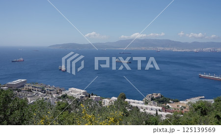 Cargo Ships Sailing on the Strait of Gibraltar near the City of Algeciras, Spain Cargo Ships Sailing on the Strait of Gibraltar near the City of Algeciras, Spain 125139569
