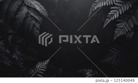 A dark background framed by lush green ferns 125140049