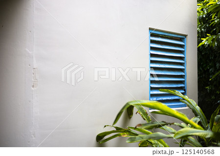 Blue Wooden Ventilation Vents On Building Walls, Background for advertising and wallpaper in structure and buildings scene Blue Wooden Ventilation Vents On Building Walls, Background for advertising and wallpaper in structure and buildings scene 125140568