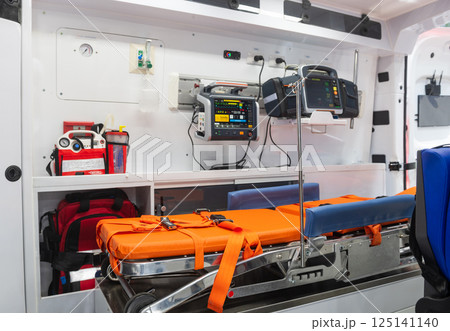 Side view of ambulance interior with medical equipment Side view of ambulance interior with medical equipment 125141140
