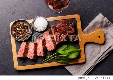 A perfectly cooked sliced striploin steak with a juicy, tender texture 125141544