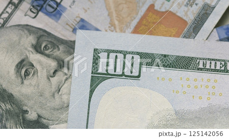 A detailed closeup view of US Dollar banknotes beautifully fanned out for easy display A detailed closeup view of US Dollar banknotes beautifully fanned out for easy display 125142056