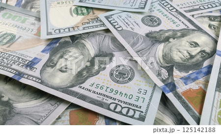 Multiple Stacks of U.S. Dollar Bills Neatly Arranged on a Table in a WellLit Room 125142188