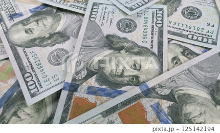 Stacks of 100 Dollar Bills Beautifully Spread Out Across the Entire Surface Area Available 125142194