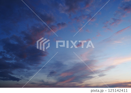 Blue pink clouds in the sky. Fantasy. The magic of sunset. Romance. Harmony. 125142411