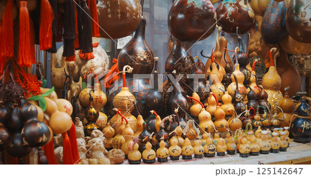 Chengdu, Sichuan, China. Souvenir Pumpkins. Souvenirs From Bottle Gourd Or Calabash. Chinese Souvenir Shop. Opo Squash, Calabash Or Hulu - Traditional Chinese Bottle Gourd Is Ancient Symbol For Health Chengdu, Sichuan, China. Souvenir Pumpkins. Souvenirs From Bottle Gourd Or Calabash. Chinese Souvenir Shop. Opo Squash, Calabash Or Hulu - Traditional Chinese Bottle Gourd Is Ancient Symbol For Health 125142647