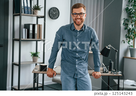 Man is working in the modern office. Conception of business and freelance Man is working in the modern office. Conception of business and freelance 125143243