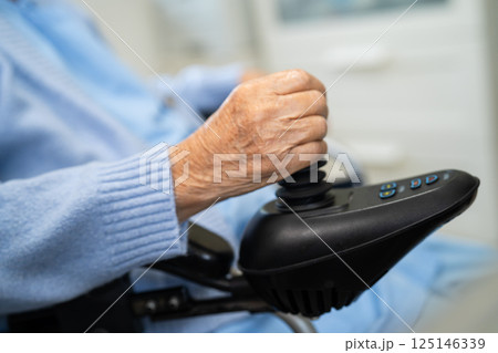 Asian senior woman patient on electric wheelchair. Asian senior woman patient on electric wheelchair. 125146339